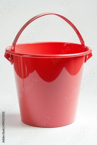 Red plastic bucket with a handle.