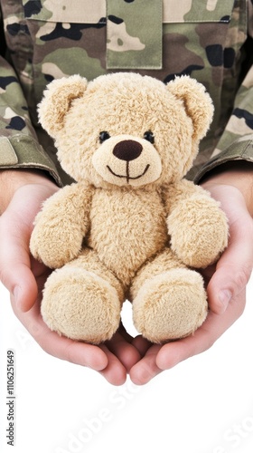 Soldier cradling a teddy bear in comforting gesture on a pure white background photo