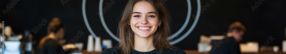 Young woman smiles happily while working at a cafe Young woman smiles happily while working at a cafe