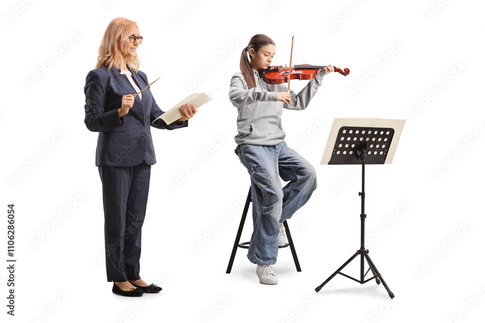 Girl practicing violin with a teacher Girl practicing violin with a teacher