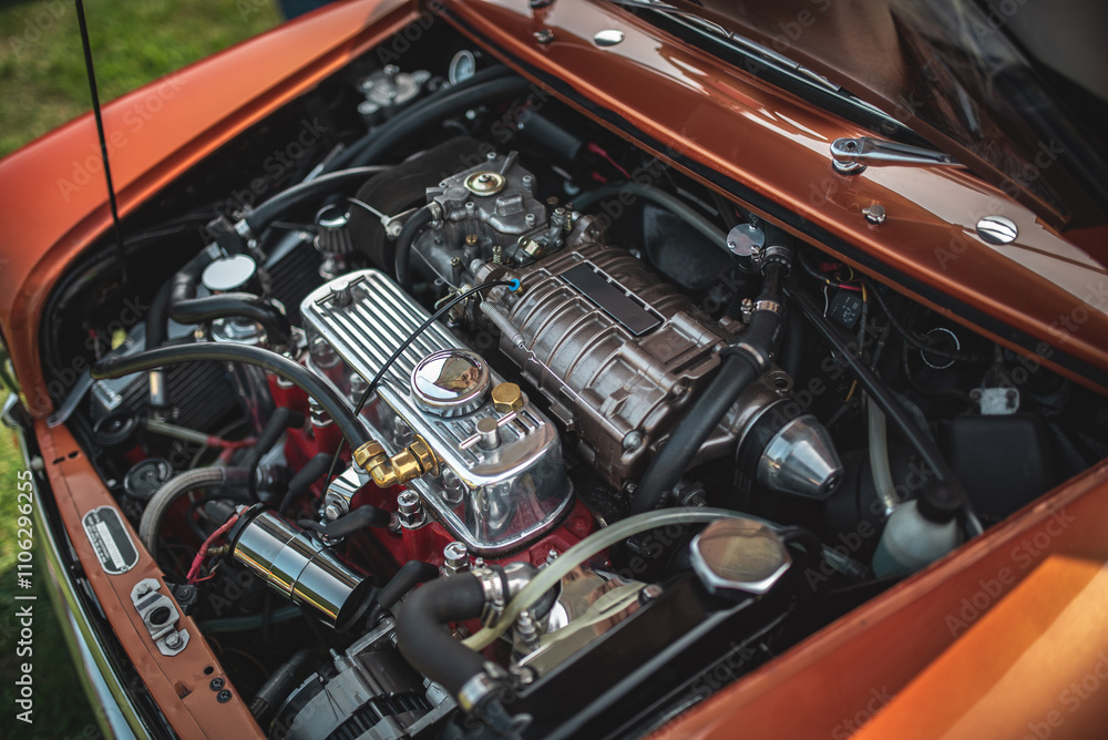 Small supercharged engine of a classic British car on a vintage car show Small supercharged engine of a classic British car on a vintage car show