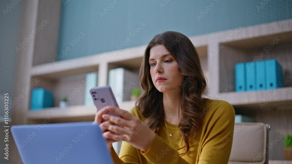 Displeased freelancer reading mobile phone message disappointed work closeup. Displeased freelancer reading mobile phone message disappointed work closeup.