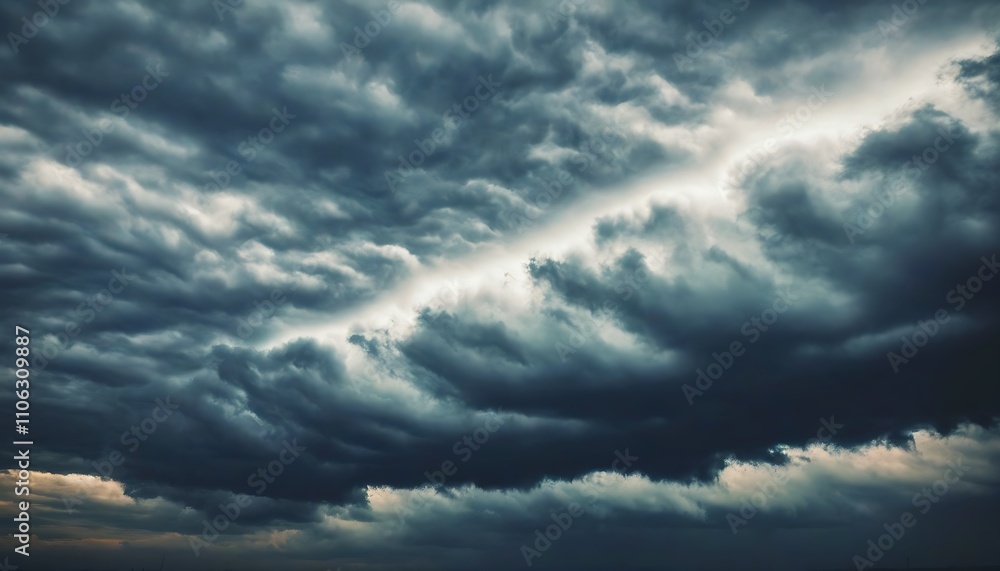 Fototapeta premium Mystic clouds loom over a deep sky, evoking a sense of wonder.