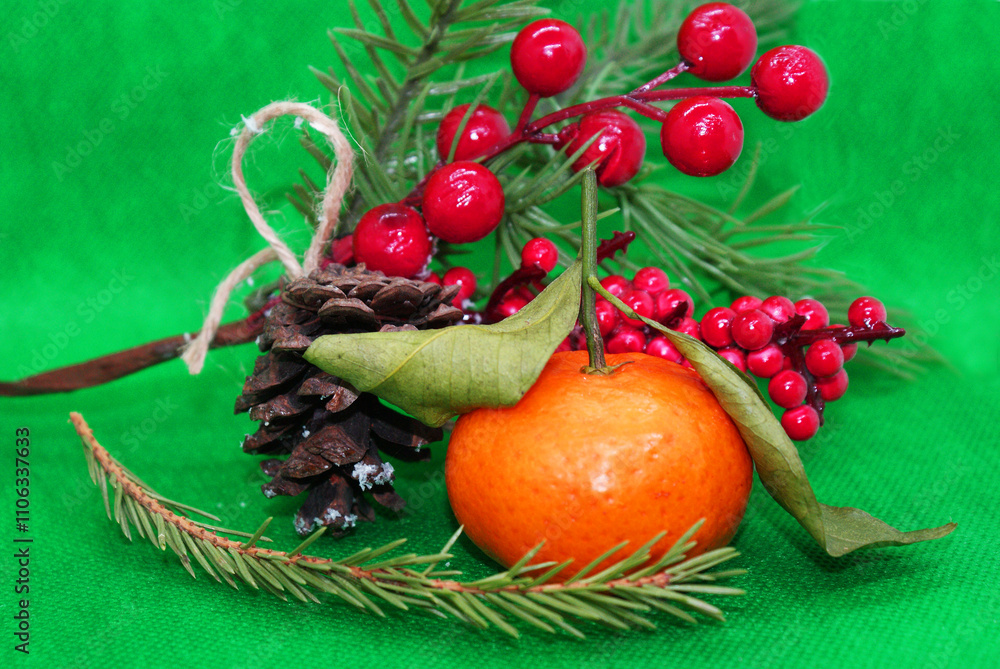 A spruce branch with a pine cone and a tangerine with leaves on a beautiful background, holiday, Christmas. A spruce branch with a pine cone and a tangerine with leaves on a beautiful background, holiday, Christmas.