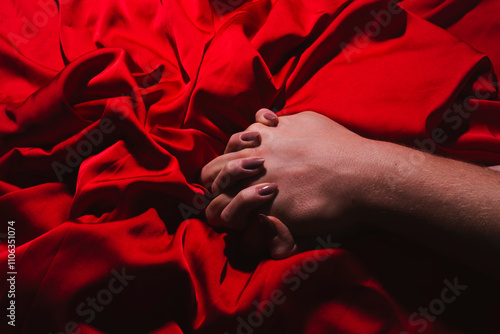 Couple sensual touch. Hands of lovers. Woman pulling sheets. Hands of love. Couple in love. Sensual hands concept. Tender couple in bed. Romance.
