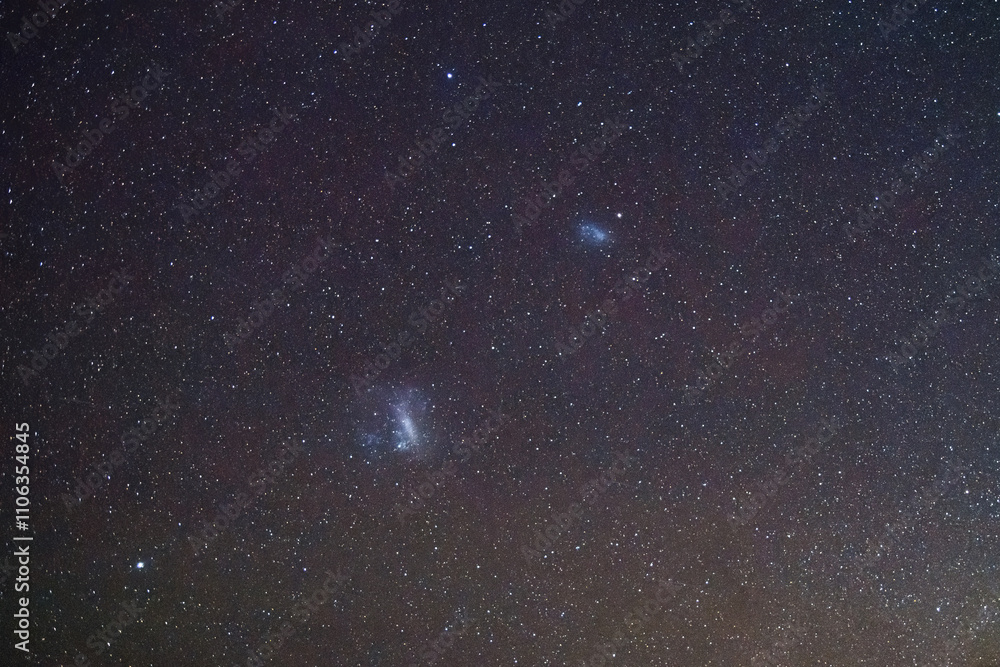 Fototapeta premium Stargazing at the celestial night sky and magellanic clouds