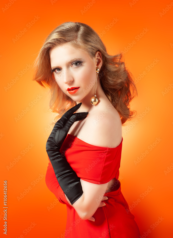Fototapeta premium Beautiful fashionable young blonde woman in a studio.