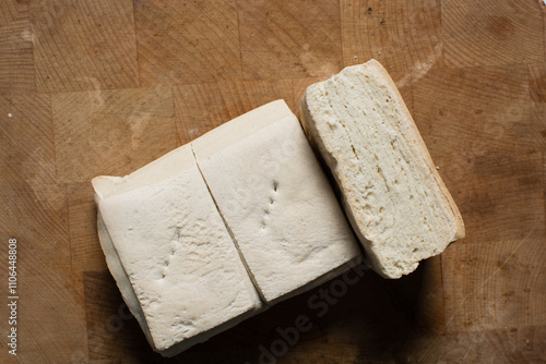 Fotografie Overhead view of hardtack bread on a wood chopping board, top view of nigerian h