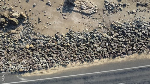 Camera pans over a rocky new zealand coastline