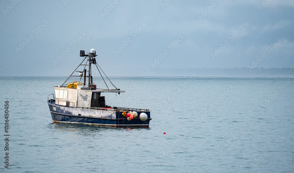 A small fishing boat in the water ocean new zealand A small fishing boat in the water ocean new zealand
