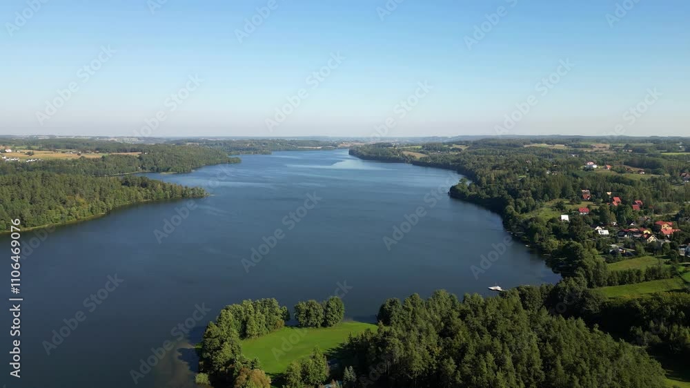 The Radunskie Dolne lake is located in the most attractive landscape part of the Kashubian Landscape Park called Kashubian Switzerland. Aerial view, Poland. The Radunskie Dolne lake is located in the most attractive landscape part of the Kashubian Landscape Park called Kashubian Switzerland. Aerial view, Poland.
