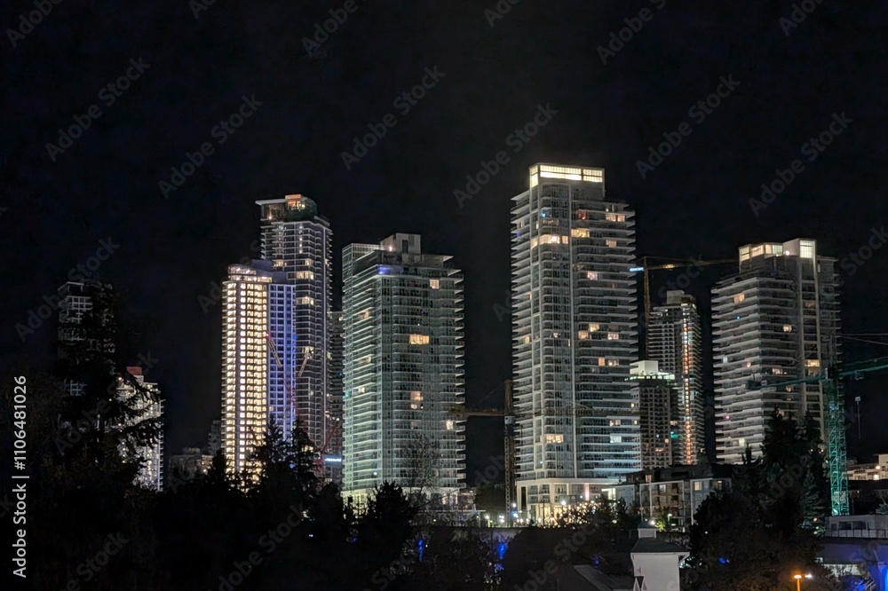 An apartment complex during at night in British Columbia, Canada An apartment complex during at night in British Columbia, Canada