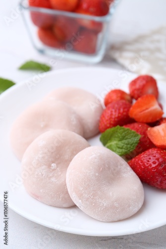 Delicious mochi and strawberries on table, closeup