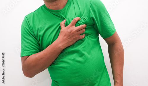 Men have chest pain caused by heart disease, heart attack, heart leakage, coronary heart disease photo