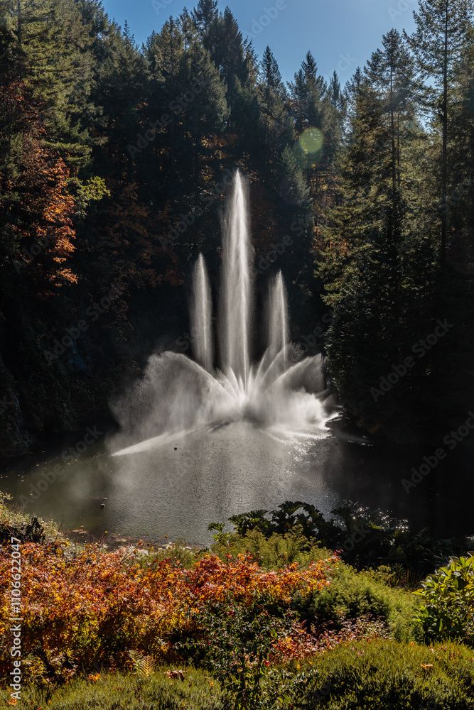 Fototapeta premium A waterfall is spraying water into a lake