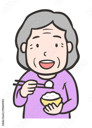 ご飯を食べる高齢者の女性