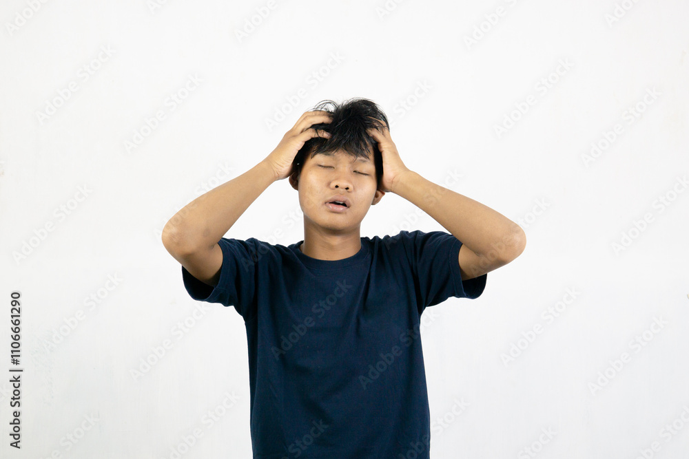 Asian man with sleepy expression with messy hair. Wake up concept. Isolated on white background Asian man with sleepy expression with messy hair. Wake up concept. Isolated on white background
