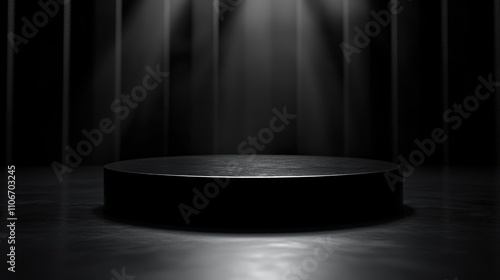 Black Cylindrical Platform with Spotlight in Dark Room