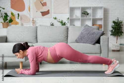 Sporty young pregnant woman...