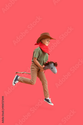 Cute little cowboy with toy...