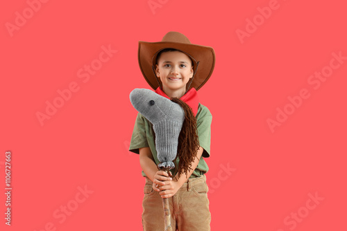 Cute little cowboy with toy...