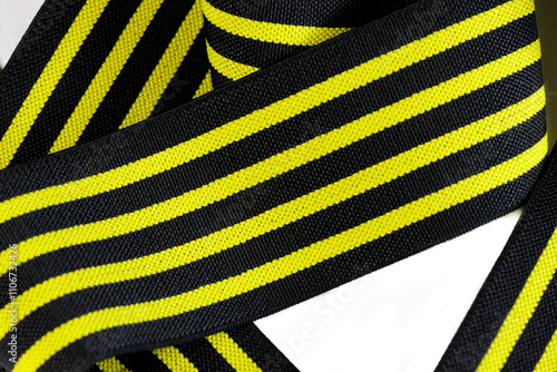 knee wraps yellow back ground white photo