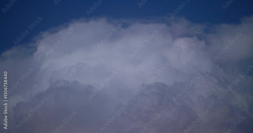 White fluffy clouds against dark blue sky video White fluffy clouds against dark blue sky video