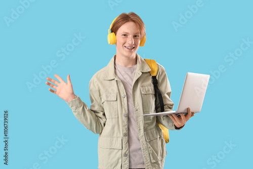 Happy young student with la...