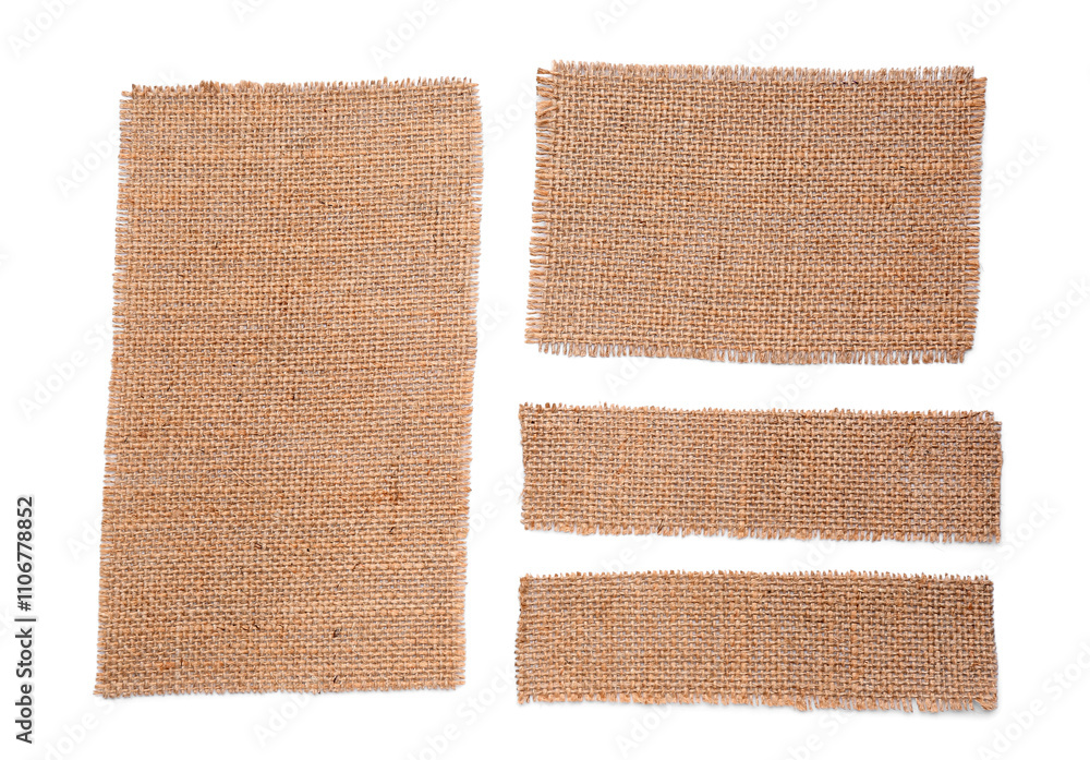 Fototapeta premium Pieces of burlap fabric on white background