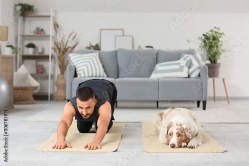 Man stretching on yoga mat ...