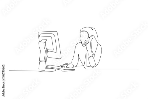 Woman on phone, working at computer.