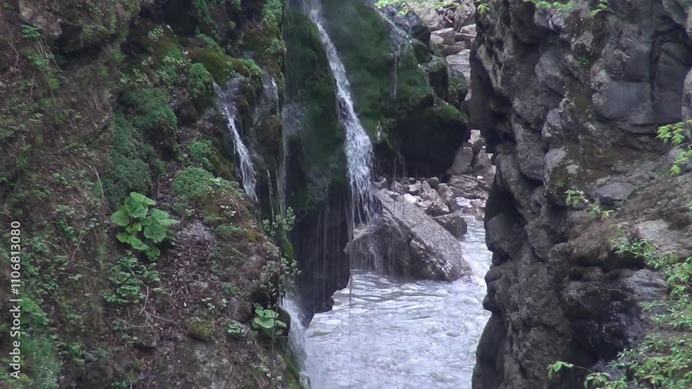 Caucasus, North Ossetia. Digoria gorge. Waterfall on the rocks.