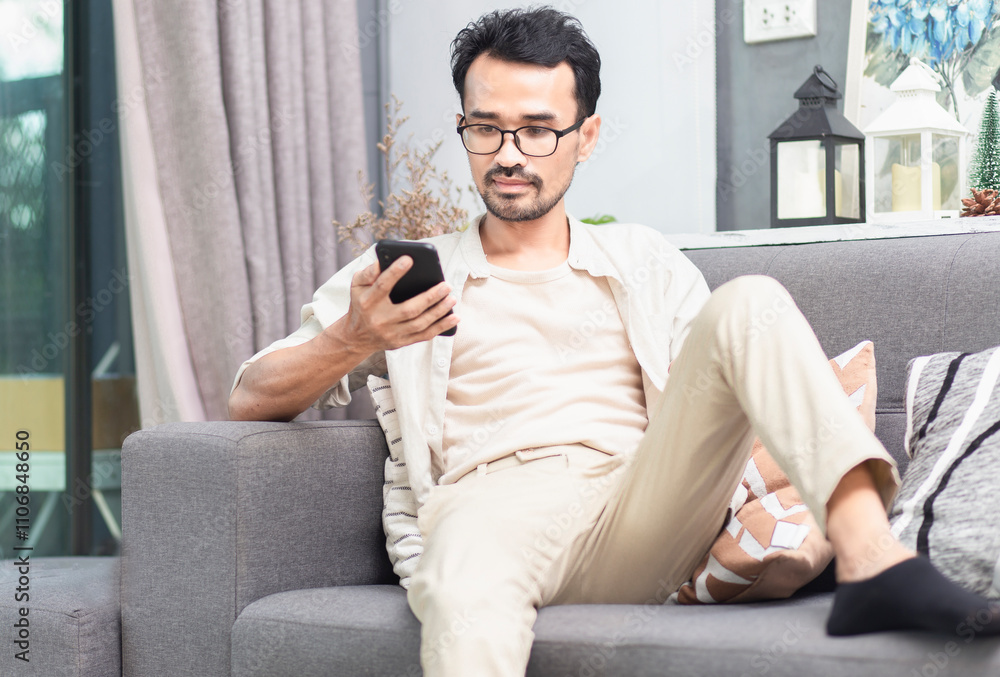 Fototapeta premium man using smartphone with online application, shopping , social media, socila network, online education, during sitting at home