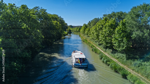 Vacation boat in Canal du Midi, family travel cruise by barge penichette, holidays in Southern France