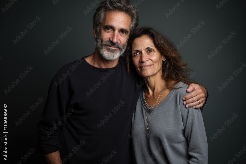 A man and woman are posing for a picture A man and woman are posing for a picture