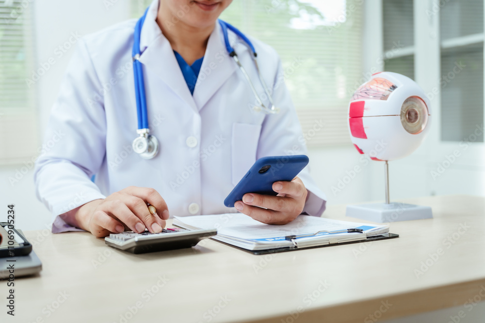 A male doctor wearing glasses sits at a desk in a hospital, explaining eye diseases like glaucoma, cataracts, pterygium, and diabetic retinopathy. Early detection helps prevent vision loss A male doctor wearing glasses sits at a desk in a hospital, explaining eye diseases like glaucoma, cataracts, pterygium, and diabetic retinopathy. Early detection helps prevent vision loss