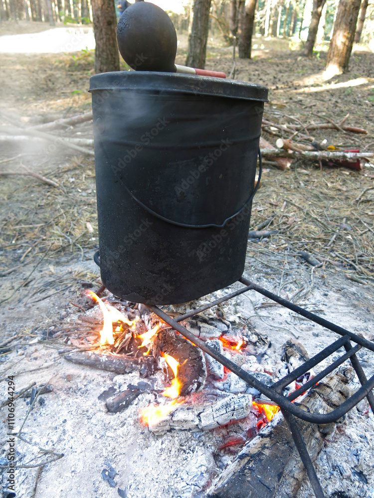 tourist boilers are heated on a campfire tourist boilers are heated on a campfire