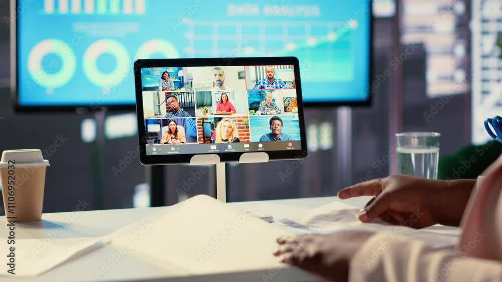 African american CEO sharing sales insight on videocall with forecast affiliates, discussing about profit and analytics in a high end office. Entrepreneur looking to expand her enterprise. Camera A. African american CEO sharing sales insight on videocall with forecast affiliates, discussing about profit and analytics in a high end office. Entrepreneur looking to expand her enterprise. Camera A.