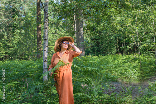 Woman on holiday in summer forest