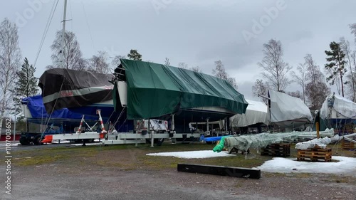 Properly Storing Boats Under Covers During the Winter at a Local Marina Facility