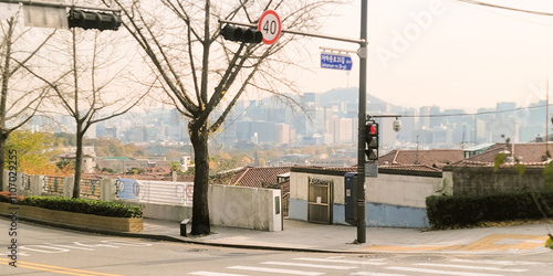 Autumnal street view of Jongno with a cityscape in the background, in Seoul, Korea, in a peaceful and serene atmosphere photo