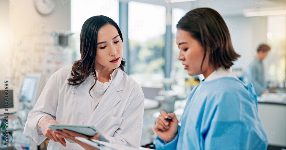 Clipboard, tablet or teaching with doctor and medical student in hospital for education or learning. Documents, feedback or study with mentor woman and Japanese intern student in healthcare clinic Clipboard, tablet or teaching with doctor and medical student in hospital for education or learning. Documents, feedback or study with mentor woman and Japanese intern student in healthcare clinic