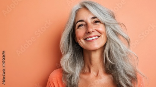 Image of a beautiful senior woman posing on a beauty photo session. Middle aged woman on a colored background. Concept about body positivity, self esteem and body acceptance