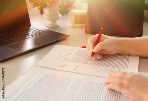 hand holding pencil over bubble proofreading paper