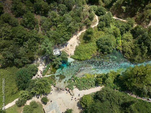 Aerial drone panorama landscape of Blue Eye (aka Syri i Kalter, springs of Bistrice) water spring. Located in Muzine in Finiq municipality, Albania photo