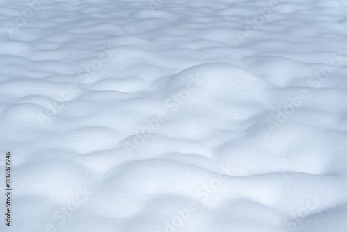 Close-up at purify white snowflake with softness surface that the snow falling on ground. Background and texture from nature condition. photo