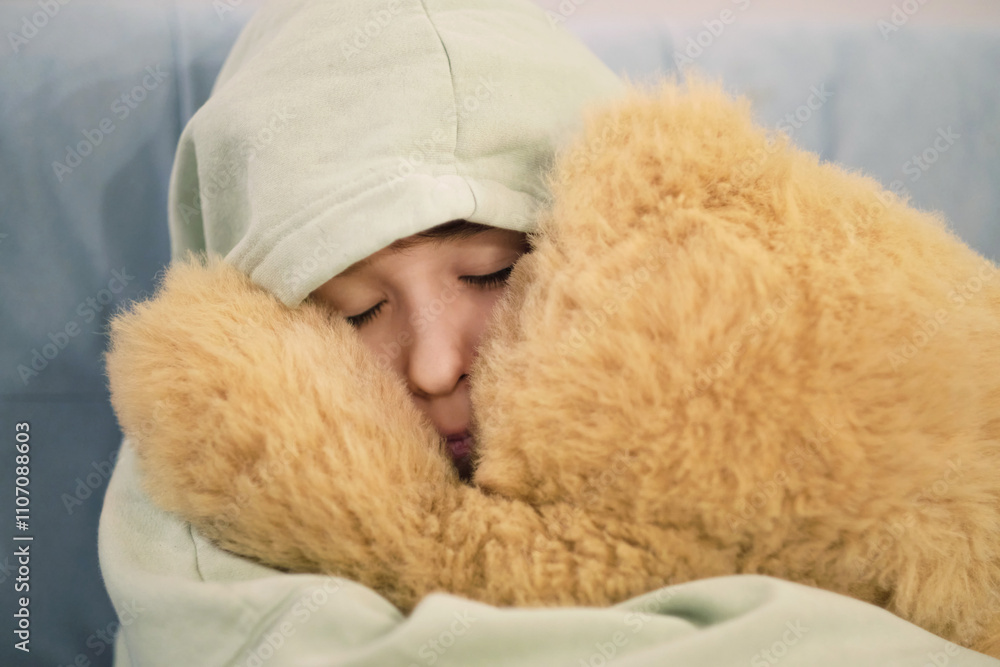 A close-up of a child enjoying a quiet moment, holding a plush teddy bear, evoking feelings of security and coziness. A close-up of a child enjoying a quiet moment, holding a plush teddy bear, evoking feelings of security and coziness.