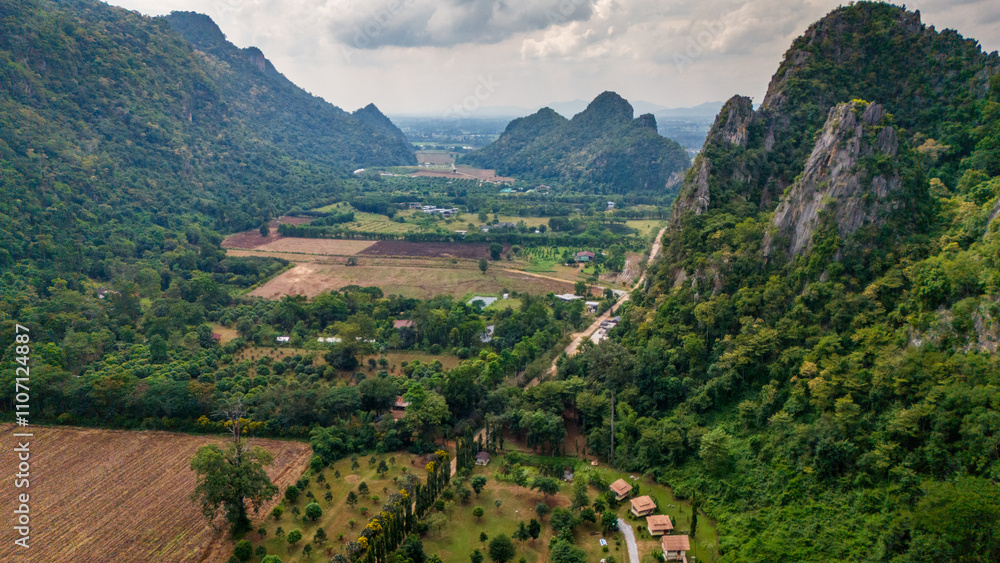 Aerial of Ban Chai Khao limestone mountains in Thailand Uthai Thani province , drone fly above famous Thai-Switzerland Aerial of Ban Chai Khao limestone mountains in Thailand Uthai Thani province , drone fly above famous Thai-Switzerland