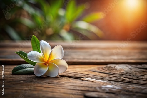 A serene spa scene featuring plumeria flowers on a wooden table, inviting relaxation and wellness. Embrace tranquility and rejuvenate your spirit in natural surroundings.