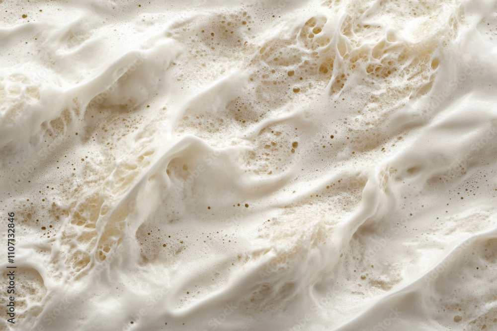 Textured seafoam on wet sand, intricate white foam patterns blending into beige grains, coastal and dynamic Textured seafoam on wet sand, intricate white foam patterns blending into beige grains, coastal and dynamic